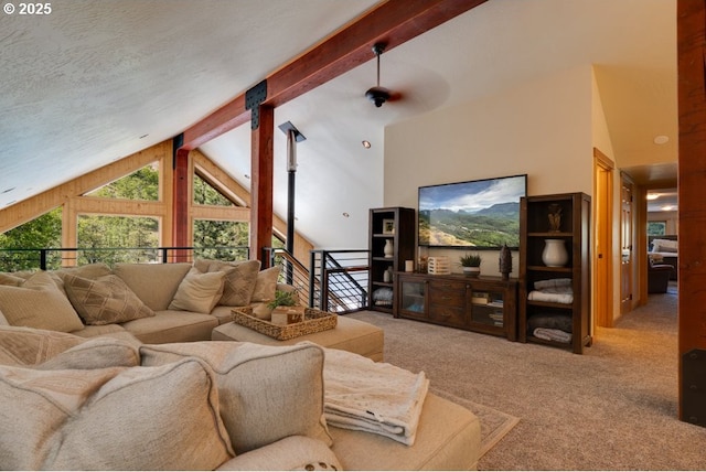 carpeted living room with beamed ceiling, high vaulted ceiling, and a textured ceiling