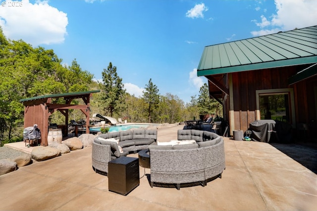 view of patio featuring an outdoor living space, a gazebo, and area for grilling