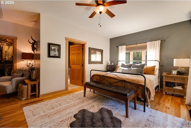 bedroom featuring light hardwood / wood-style floors and ceiling fan