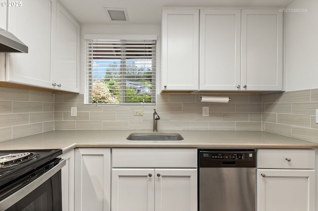kitchen featuring dishwasher, a sink, white cabinets, and light countertops
