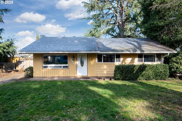 ranch-style home with a front lawn