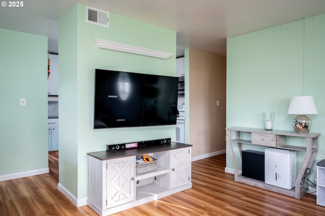 unfurnished living room featuring hardwood / wood-style flooring