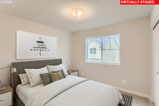 bedroom with carpet and baseboards