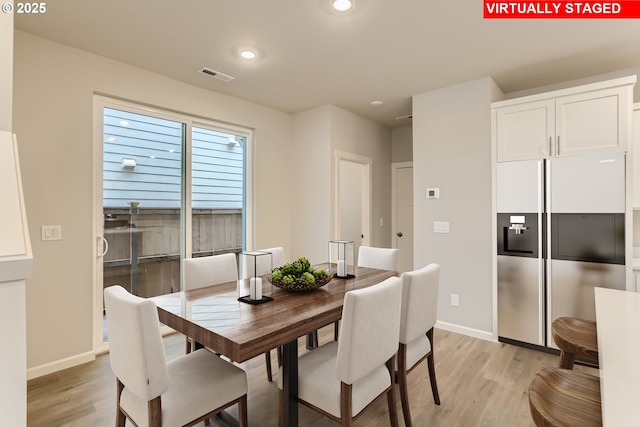 dining room featuring light wood-style floors, recessed lighting, visible vents, and baseboards