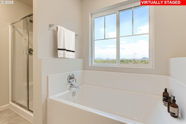 bathroom featuring plus walk in shower