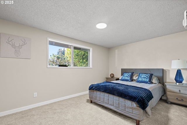 carpeted bedroom featuring a textured ceiling