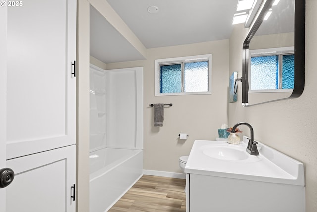 full bathroom featuring vanity, shower / washtub combination, hardwood / wood-style floors, and toilet