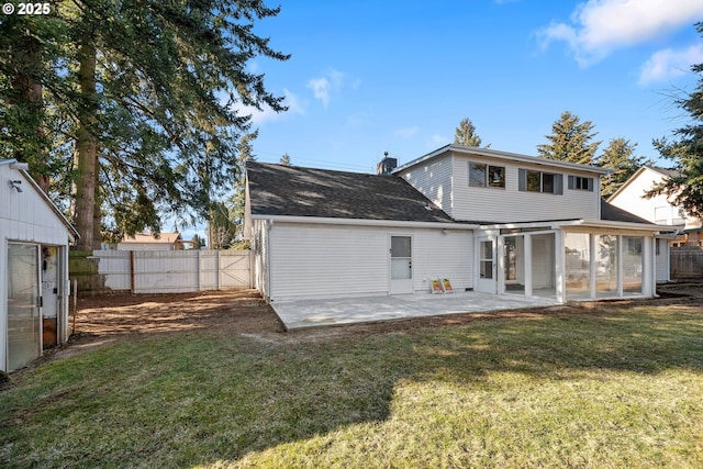 back of property featuring a yard and a patio area