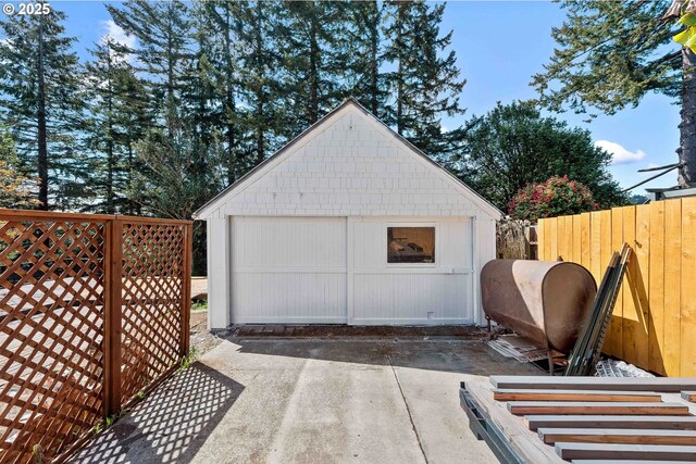 garage with fence and heating fuel