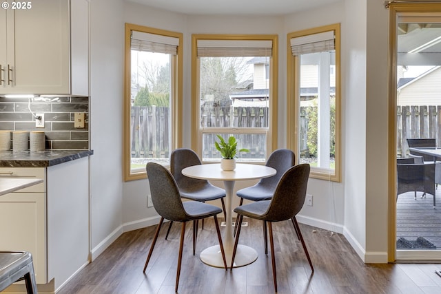 dining area featuring dark hardwood / wood-style floors