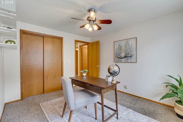 carpeted office with ceiling fan