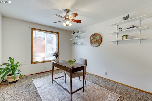 office with carpet floors and ceiling fan