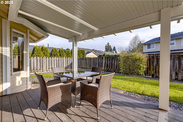 wooden deck with a lawn