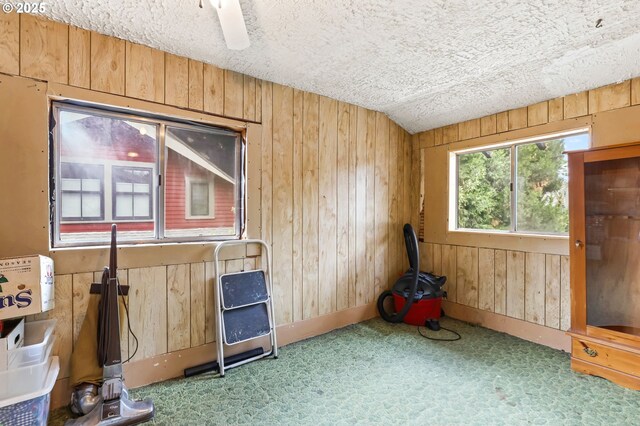3235 NE 65th Ave, Portland, OR 97213 - spare room with carpet, wooden walls, and a textured ceiling