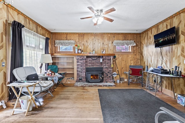 3235 NE 65th Ave, Portland, OR 97213 - living area featuring healthy amount of natural light, wood finished floors, wooden walls, ceiling fan, and crown molding
