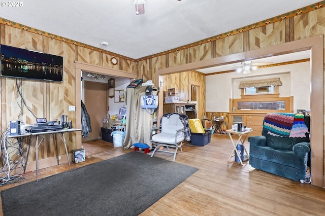 3235 NE 65th Ave, Portland, OR 97213 - exercise area with a ceiling fan, wood walls, and wood finished floors