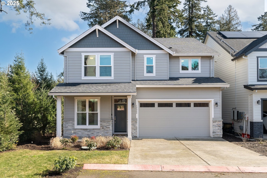 craftsman house with a garage and a porch