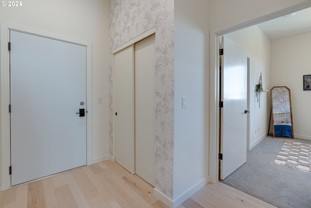 foyer with light hardwood / wood-style floors