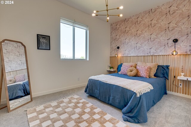 bedroom featuring a chandelier and carpet floors