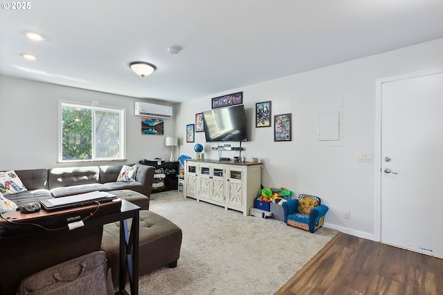 living room featuring hardwood / wood-style flooring and an AC wall unit