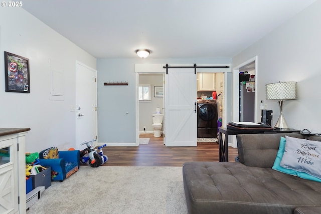 living room featuring hardwood / wood-style flooring and a barn door