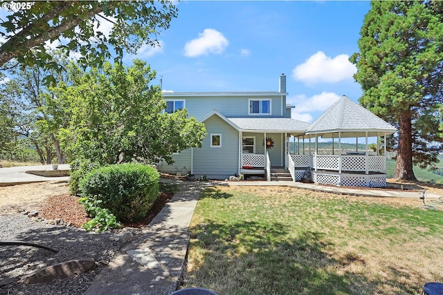 view of front of house with a gazebo, a porch, and a front yard