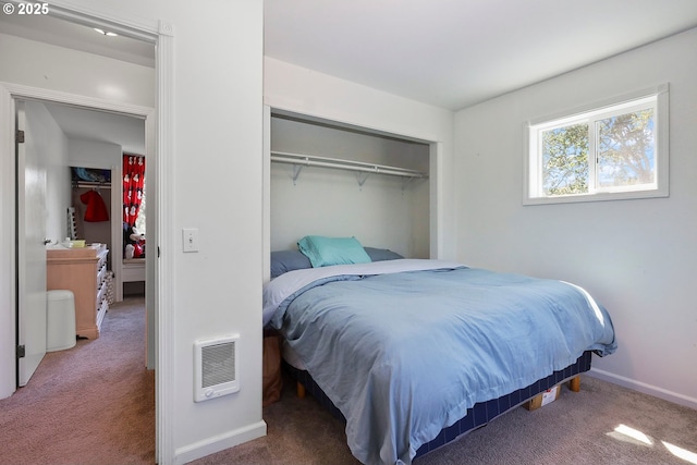 bedroom featuring carpet and a closet