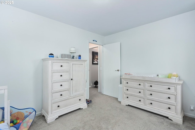 bedroom with light colored carpet