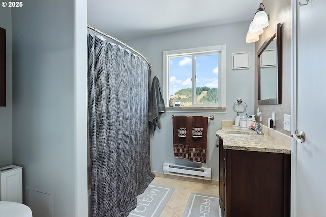 bathroom featuring vanity, tile patterned floors, baseboard heating, and a shower with curtain