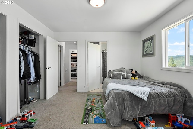 carpeted bedroom with a closet