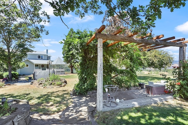 view of yard with a pergola and a patio area