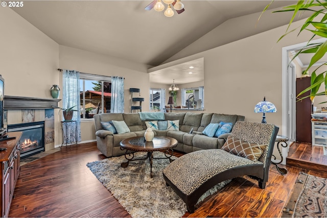 719 NE Quince Ave, Redmond, OR 97756 - living area featuring lofted ceiling, hardwood / wood-style flooring, a fireplace, a chandelier, and baseboards