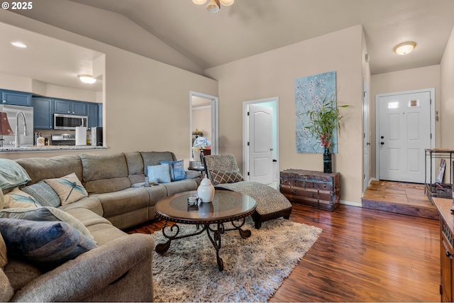 719 NE Quince Ave, Redmond, OR 97756 - living room with lofted ceiling, dark wood finished floors, and baseboards