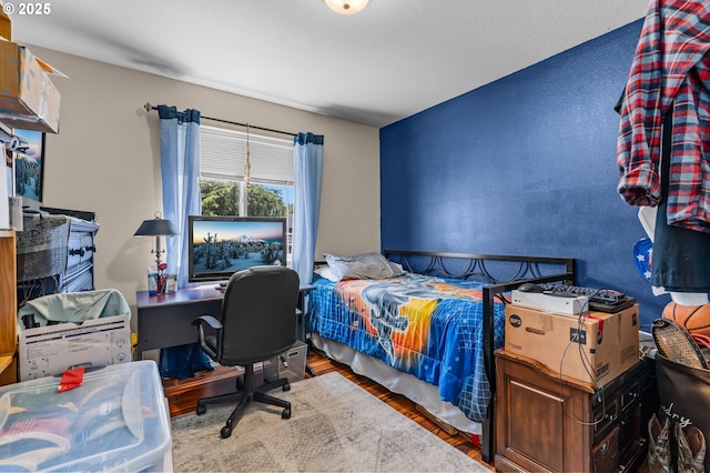 719 NE Quince Ave, Redmond, OR 97756 - bedroom featuring wood finished floors and an office area