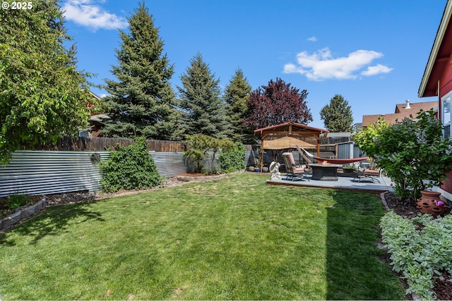 719 NE Quince Ave, Redmond, OR 97756 - view of yard with an outdoor fire pit, a gazebo, and a patio