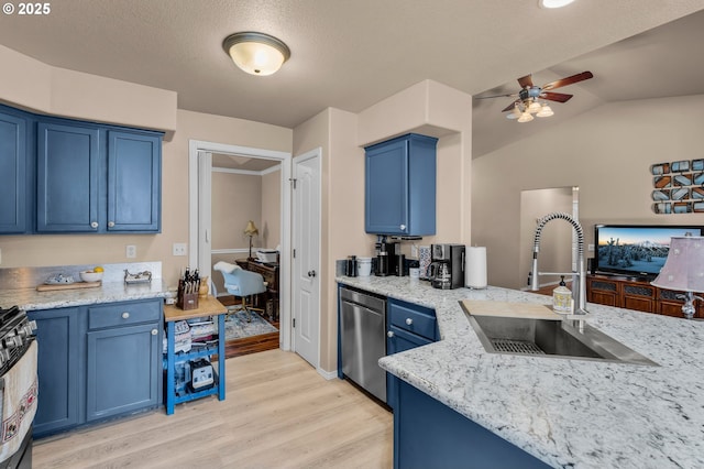719 NE Quince Ave, Redmond, OR 97756 - kitchen featuring stainless steel dishwasher, a sink, blue cabinets, light wood-style flooring, and lofted ceiling