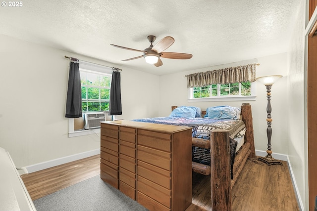 2472 Willamina Ave, Forest Grove, OR 97116 - bedroom with multiple windows, cooling unit, baseboards, and a textured ceiling