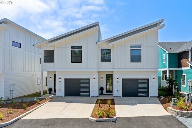 42 Washington St, Rockaway Beach, OR 97136 - modern farmhouse with board and batten siding, concrete driveway, and a garage