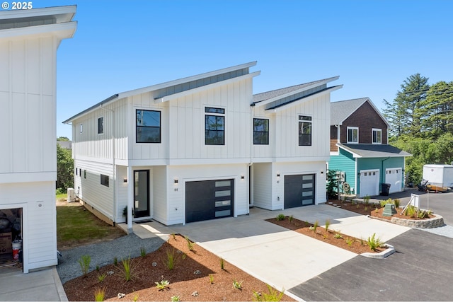 42 Washington St, Rockaway Beach, OR 97136 - modern inspired farmhouse featuring board and batten siding, concrete driveway, and a garage