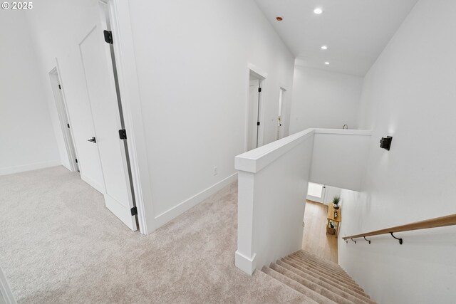 42 Washington St, Rockaway Beach, OR 97136 - corridor featuring an upstairs landing, light carpet, and recessed lighting
