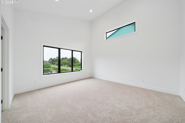 42 Washington St, Rockaway Beach, OR 97136 - carpeted empty room with baseboards and recessed lighting