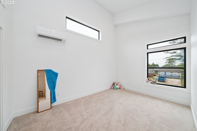 42 Washington St, Rockaway Beach, OR 97136 - empty room featuring an AC wall unit and carpet floors