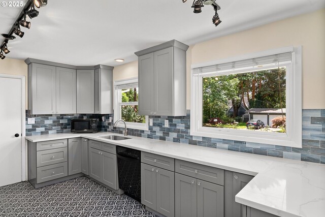 4545 SW Poplar Ln, Portland, OR 97225 - kitchen featuring gray cabinetry, black appliances, track lighting, and decorative backsplash