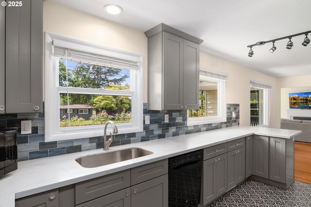 4545 SW Poplar Ln, Portland, OR 97225 - kitchen with gray cabinetry, black appliances, and backsplash