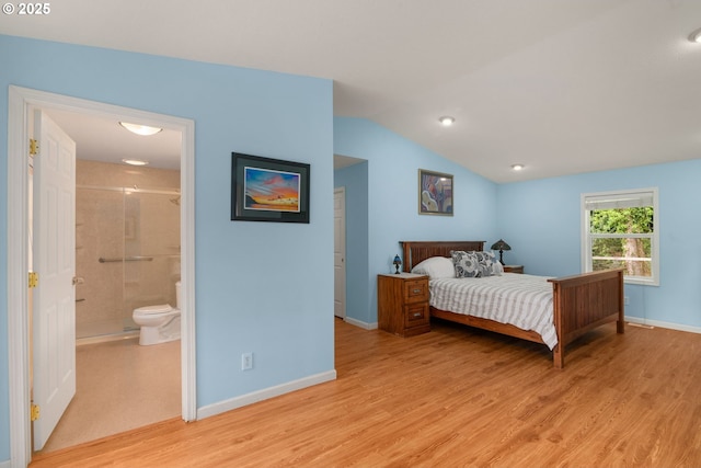 4545 SW Poplar Ln, Portland, OR 97225 - bedroom featuring light wood-style flooring, lofted ceiling, and ensuite bathroom
