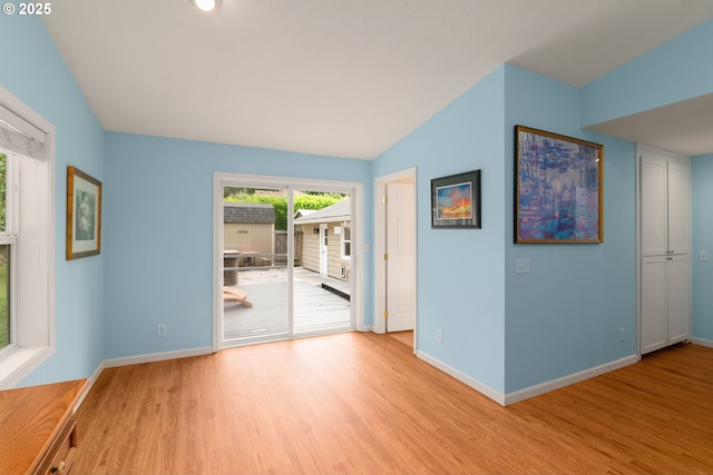 4545 SW Poplar Ln, Portland, OR 97225 - empty room featuring light wood finished floors and lofted ceiling