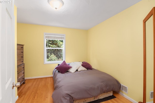4545 SW Poplar Ln, Portland, OR 97225 - bedroom with light wood-style flooring and baseboards