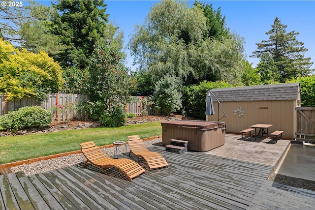 4545 SW Poplar Ln, Portland, OR 97225 - deck with a hot tub, a fenced backyard, a patio, and a storage unit
