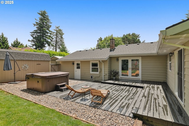 4545 SW Poplar Ln, Portland, OR 97225 - rear view of property featuring a hot tub, a wooden deck, and a shingled roof