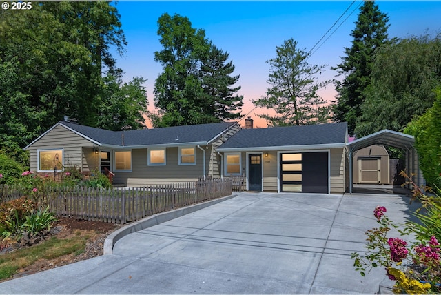 4545 SW Poplar Ln, Portland, OR 97225 - view of front facade with driveway, a storage unit, a garage, a fenced front yard, and a chimney